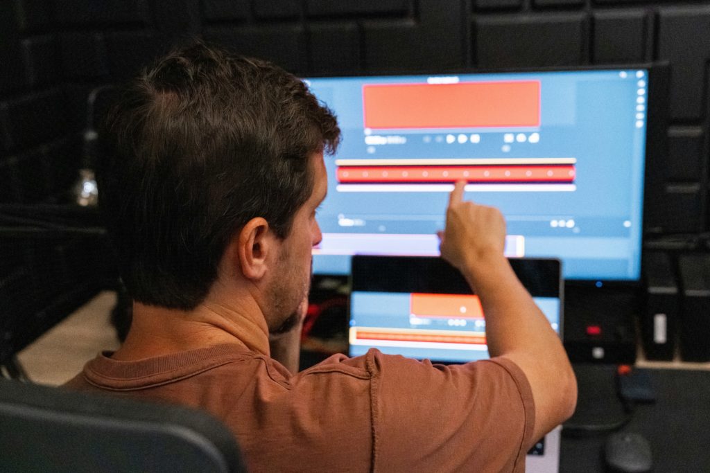 man monitoring machines on computer